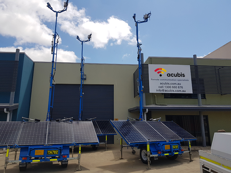 Solar comms trailers in front of Acubis office