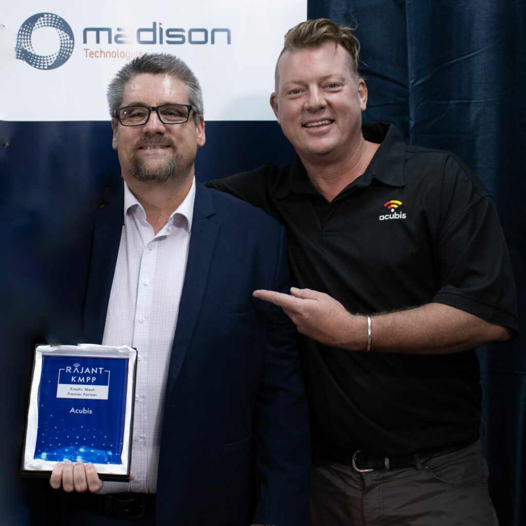 Jeff Berg with Madison rep accept Rajant accolade